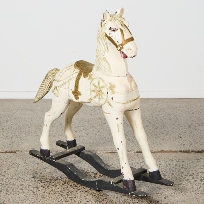 A Folk Art Painted Wooden Rocking Horse