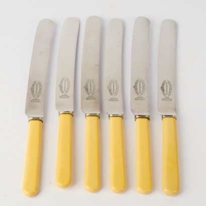 A Set of Six Stainless Steel Bone Handled Knives