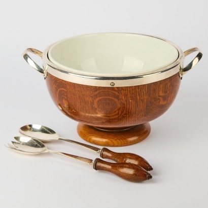 An Arts and Crafts Oak and Silver Plate Serving Bowl with Utensils