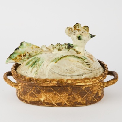 A Studio Pottery Hen in a Basket