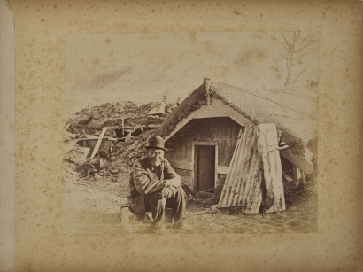 BURTON BROTHERS Rewiri outside buried whare at Wairoa