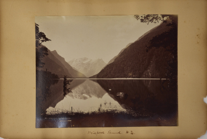 BURTON BROTHERS An album page with two Burton Brothers albumen photographs. Lake Ada and Bowen Fall Milford Sound