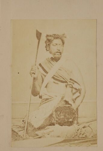 UNKNOWN PHOTOGRAPHER Two Carte de Viste. A Māori warrior posed with traditional weapons and trophy head in in studio. Studio portralt of two women.