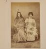 UNKNOWN PHOTOGRAPHER Two Carte de Viste. A Māori warrior posed with traditional weapons and trophy head in in studio. Studio portralt of two women. - 2