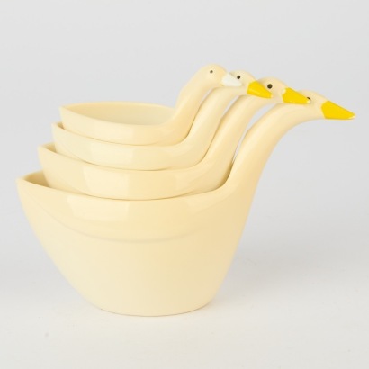 A Vintage Mother Goose Measuring Cup Set