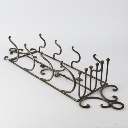 A Metal Wall Mounted Wine Bottle Rack