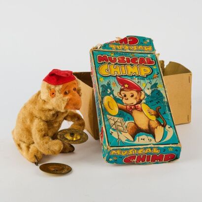 An Original Musical Chimp Wind Up Toy