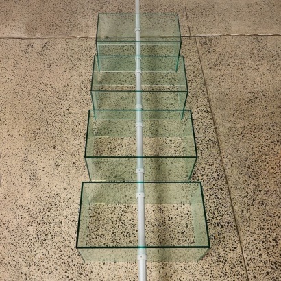 A Flood Standing Rotating Glass Display Shelving Unit