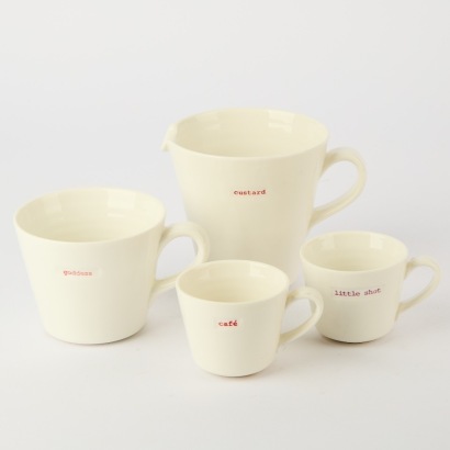 A collection of three Keith Brymer Jones Cups and one Jug