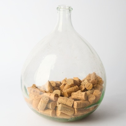 A Glass Demijohn with Wine Corks