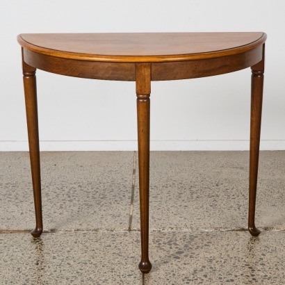 A Victorian Mahogany Demi Lune-Shaped Table