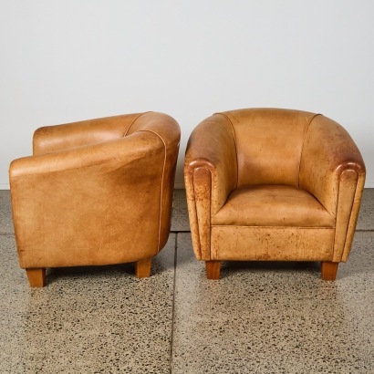 A Pair of Brown Leather Tub Chairs