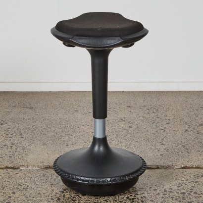 A Black Wobble Standing Stool