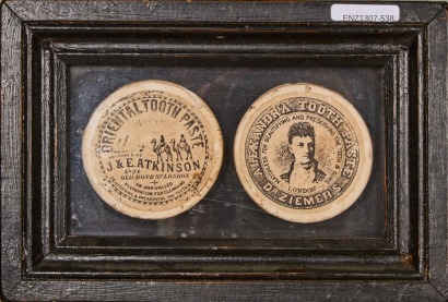 A Vintage Box Frame Display of Toothpaste Lids