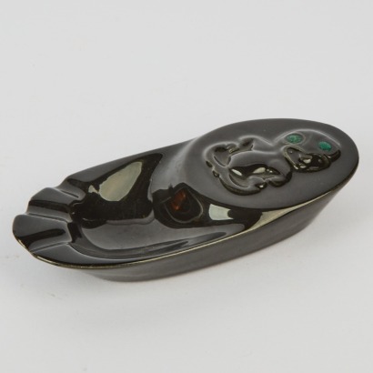 A Black Ceramic Tiki Ashtray