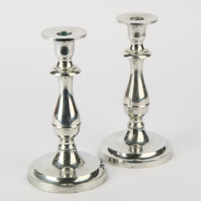 A Pair of Polished Candlestick