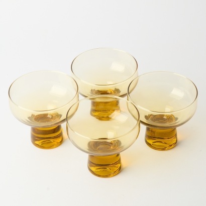 A Set of Four Kaaru glass champagne Coupes
