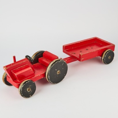 A Vintage Red Truck and Trailer Toy