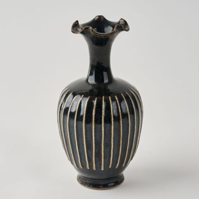A Chinese Black-glazed Lobed Vase with Fluted Decoration