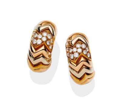 A pair of tri-colour gold and diamond Spiga earrings, Bulgari. Each earring comprised of chevron shaped links with one diamond set section. 18ct yellow, white and rose gold. Weight 27.0 grams. Length 25mm. Clip attachments.
