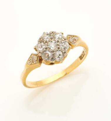 An antique diamond cluster ring, set with seven old European cut diamonds. 18ct yellow gold. Weight 2.8 grams. Size N.