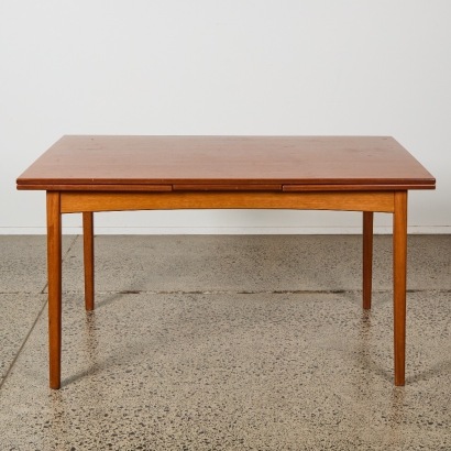 A Mid-Century Extendable Dining Table