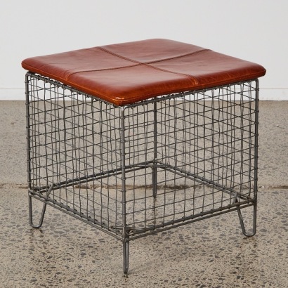 A Metal Industrial Stool with Leather Seat