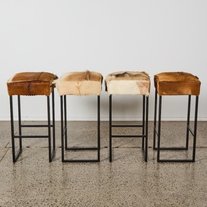 A Set of 4 Barstools with Goatskin Upholstery