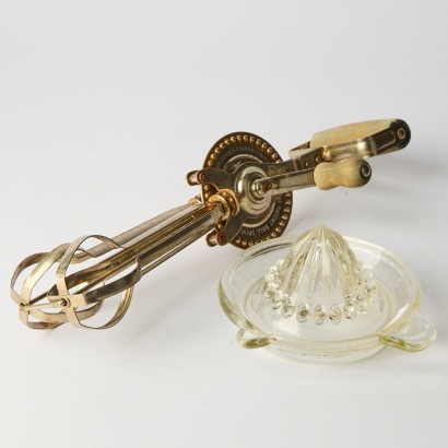 A Vintage Swift Whip Egg Beater and Glass Lemon Squeezer