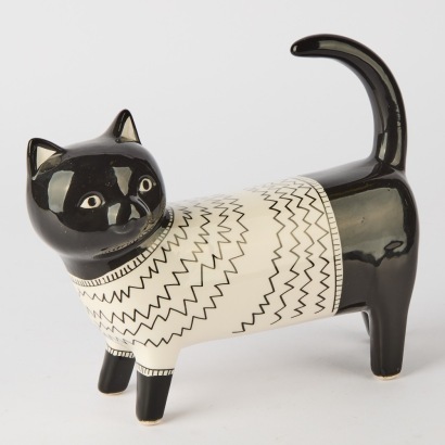 A Porcelain Cat Wearing a Sweater