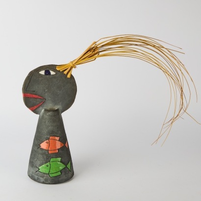 A Ceramic Figure with Grass Hair