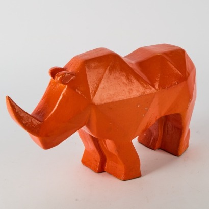A Metal Orange Rhino Statue