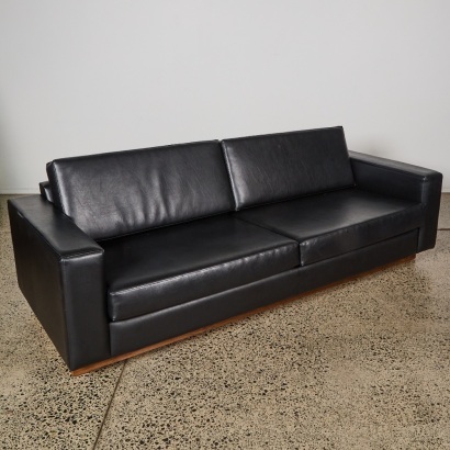 A Soho Sofa with a Walnut Floating Base