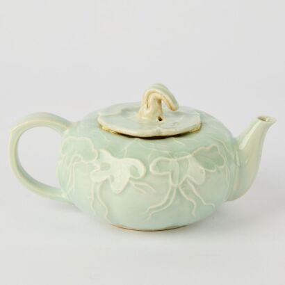 A Chinese Qing Dynasty Celadon-glazed Carved Teapot