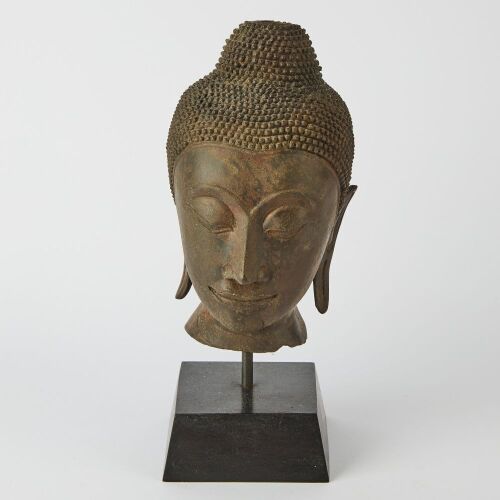 An Asian Bronze Buddha Head Ornament