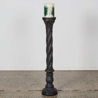 A Tall Resin Column with Candle