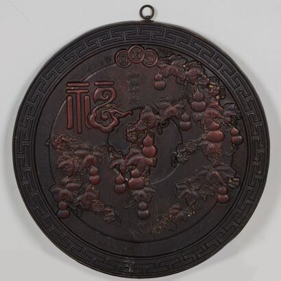 A Chinese Hardwood Circular Wall Hanging with Floral Decoration