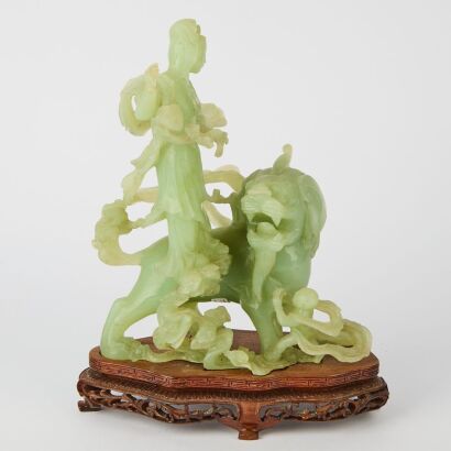 A Chinese Green Jade Carving of a Court Lady and Lion