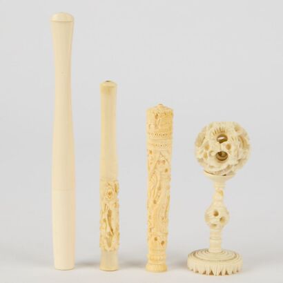 A Group of Three Chinese Bone Cigarette Holders and an Ivory Ball