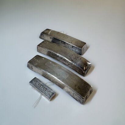 A Group of Four Chinese Silver Alloy Sycee Ingot