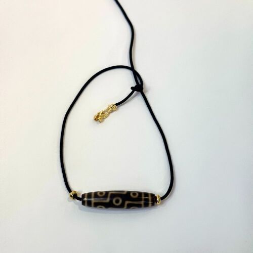 A Chinese Tibetan Nine-eyed Dzi Bead