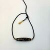 A Chinese Tibetan Nine-eyed Dzi Bead
