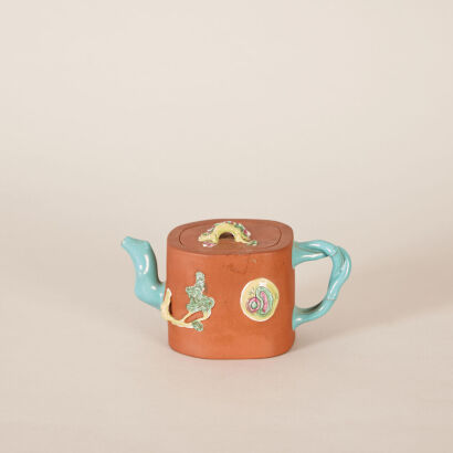 A Chinese Late Qing Dynasty Coloured Red Clay 'Pine, Bamboo and Prunus' Teapot