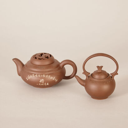 Two Chinese Red Clay Teapots (Chen Juhua Mark, Wu Yaqun Zhi Mark)