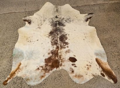 A Large Cow Hide Rug