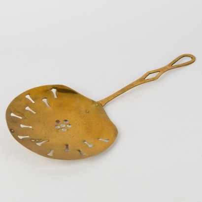 An Antique Brass Strainer Spoon