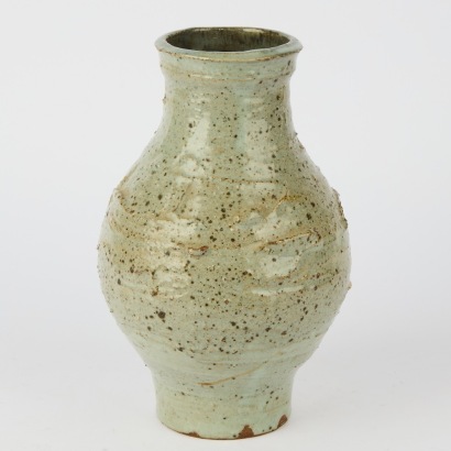 A Warren Tippett Stoneware Vase with a rough textured finish