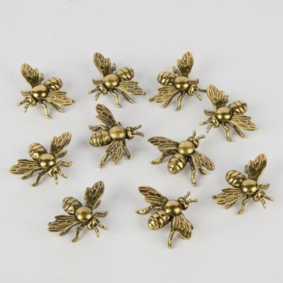A Collection of Ten Metal Bees
