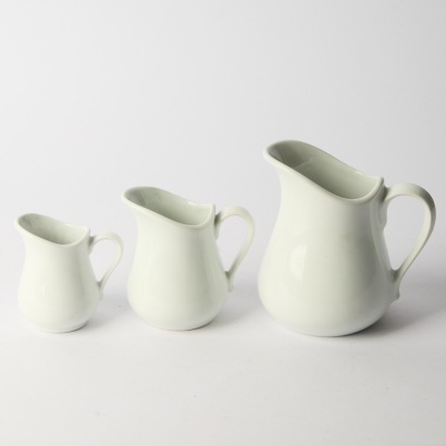 A Set of Three Graduated Apilco Jugs