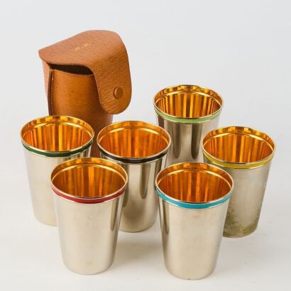 A Set of Six Vintage Stainless and Copper Travel Cups in Leather Pouch